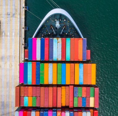 Container ship loading and unloading in deep sea port, Aerial to Container ship loading and unloading in deep sea port, Aerial top view of business logistic import and export freight transportation by container ship in open sea.